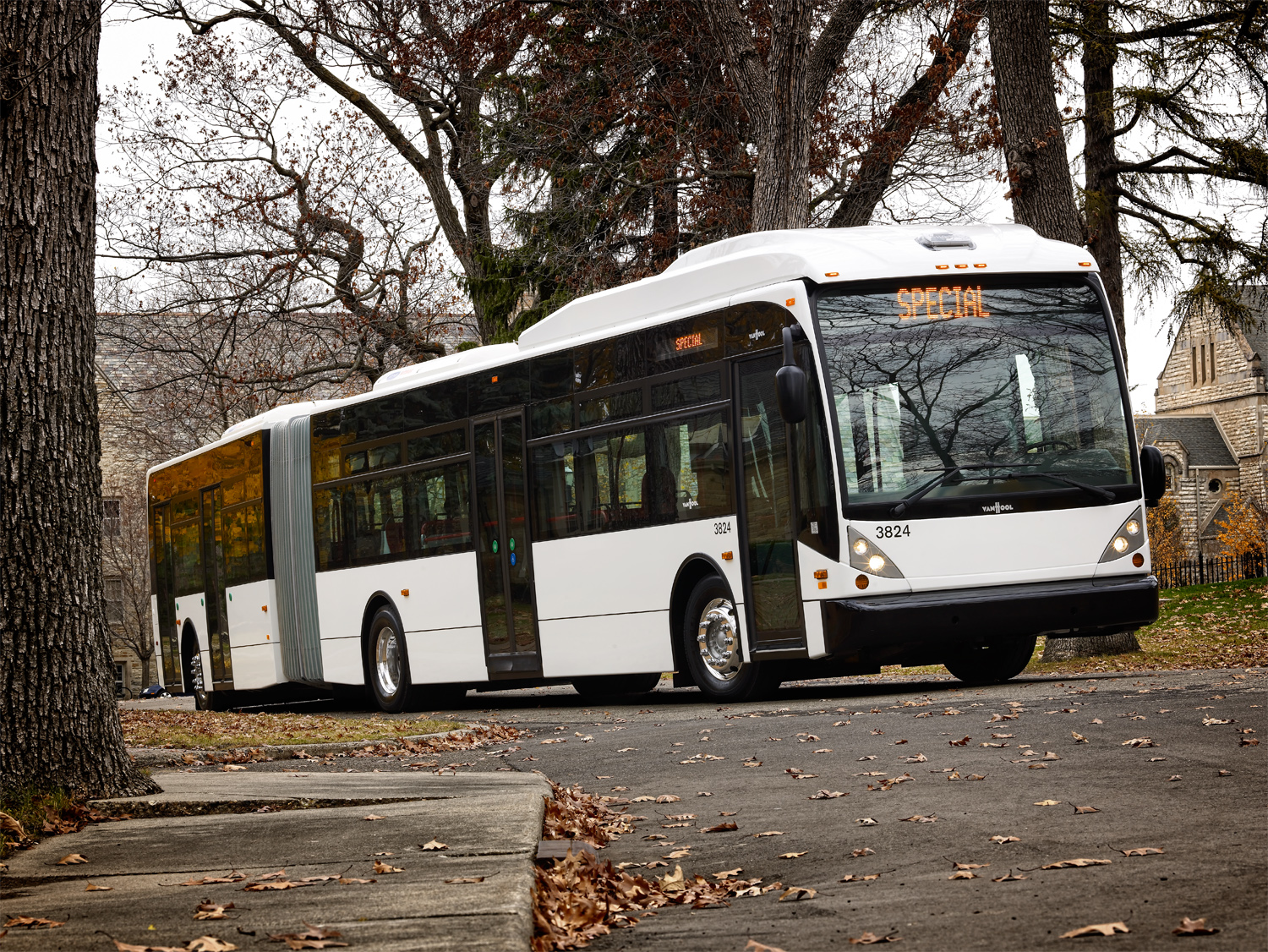 An articulating motor coach photographed on an overcast autumn day.