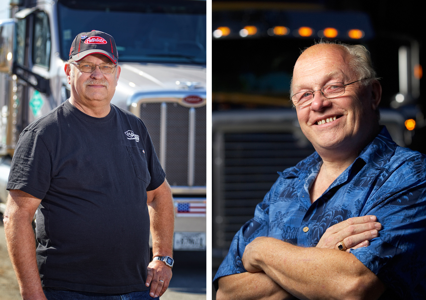 Two proud truckers pose in front of their trucks