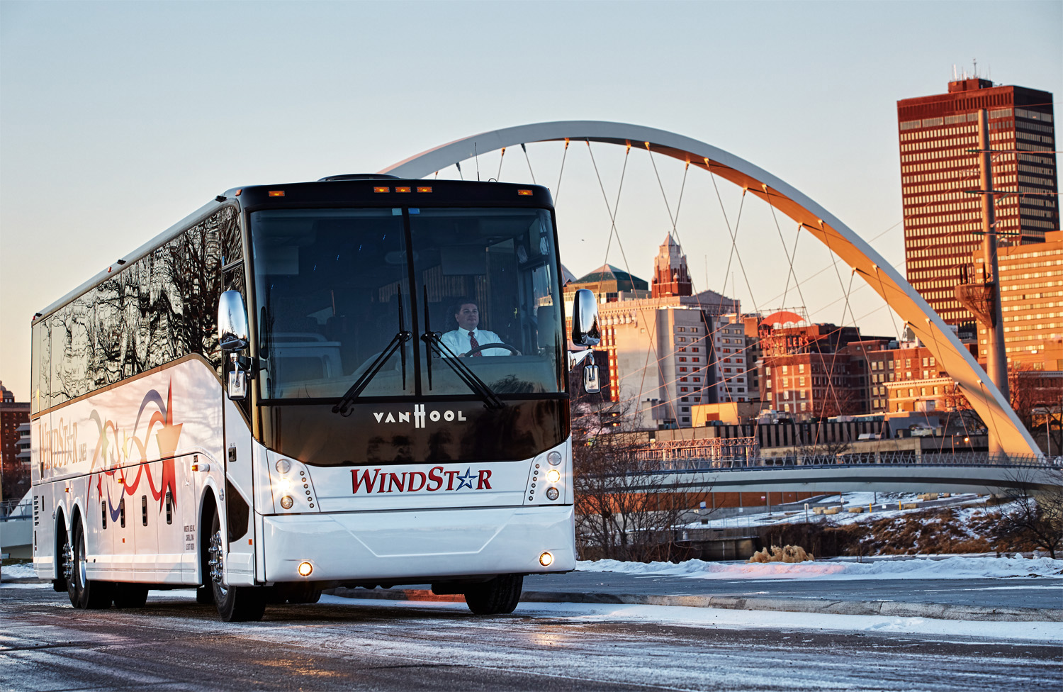 A new Van Hood motor coach basks in early morning light near downtown Des Moines, Iowa.