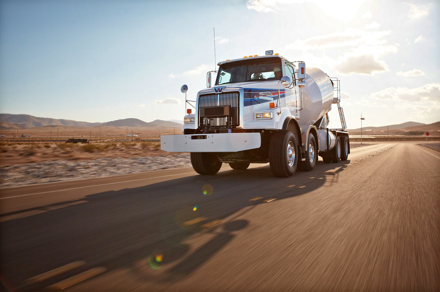 A Western Star twin-steer mixer speeds down a road in Nevada.