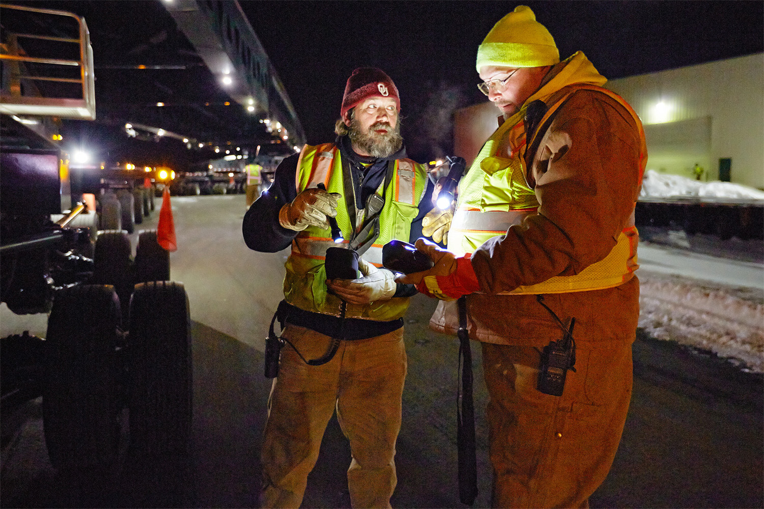 A pair of crew members share info before a late night super-sized haul.