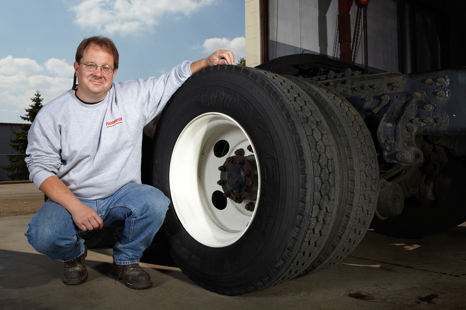 A fleet manager proudly shows off his favorite brand of tires.