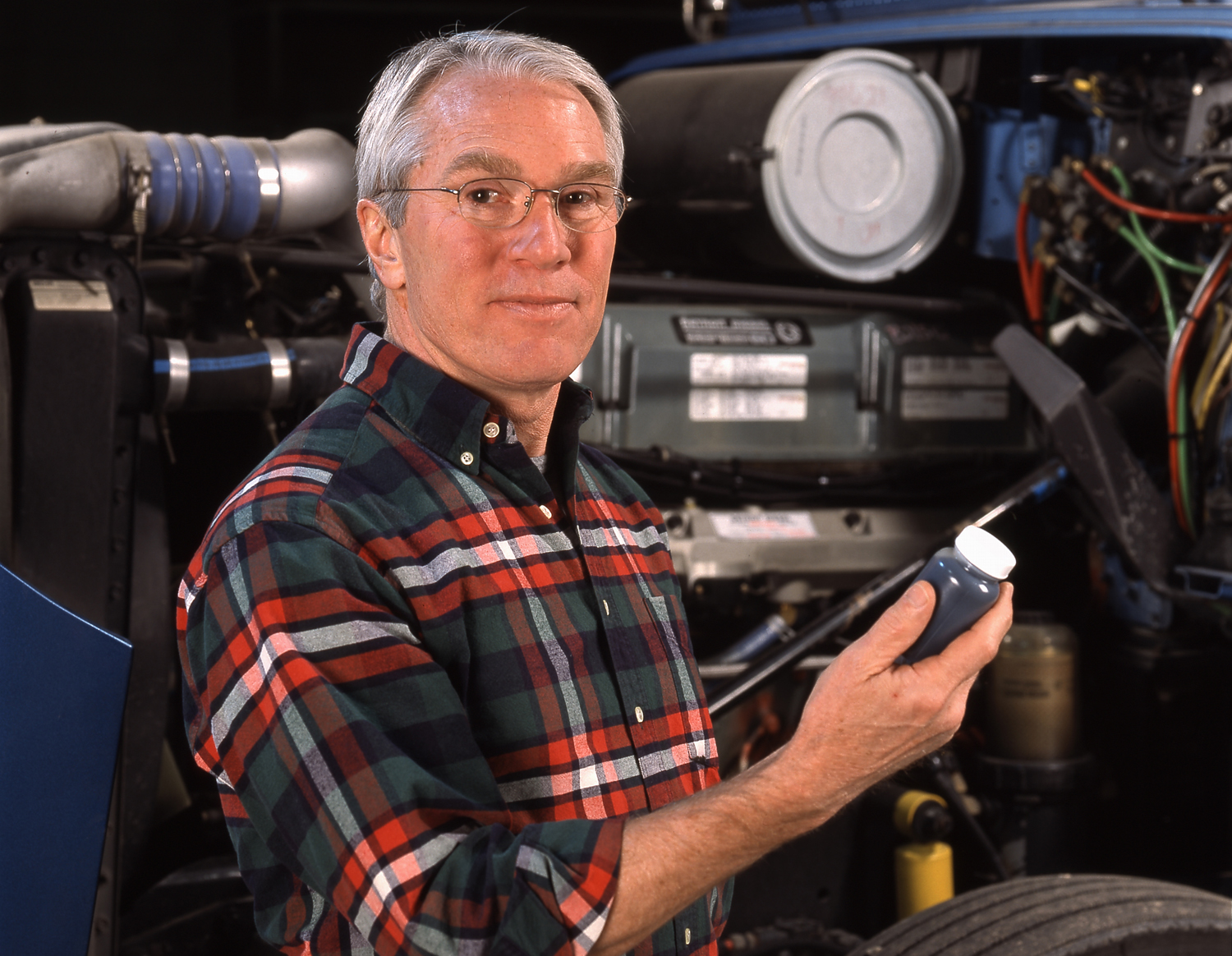 A model posing as a trucker for an advertisement promoting oil analysis