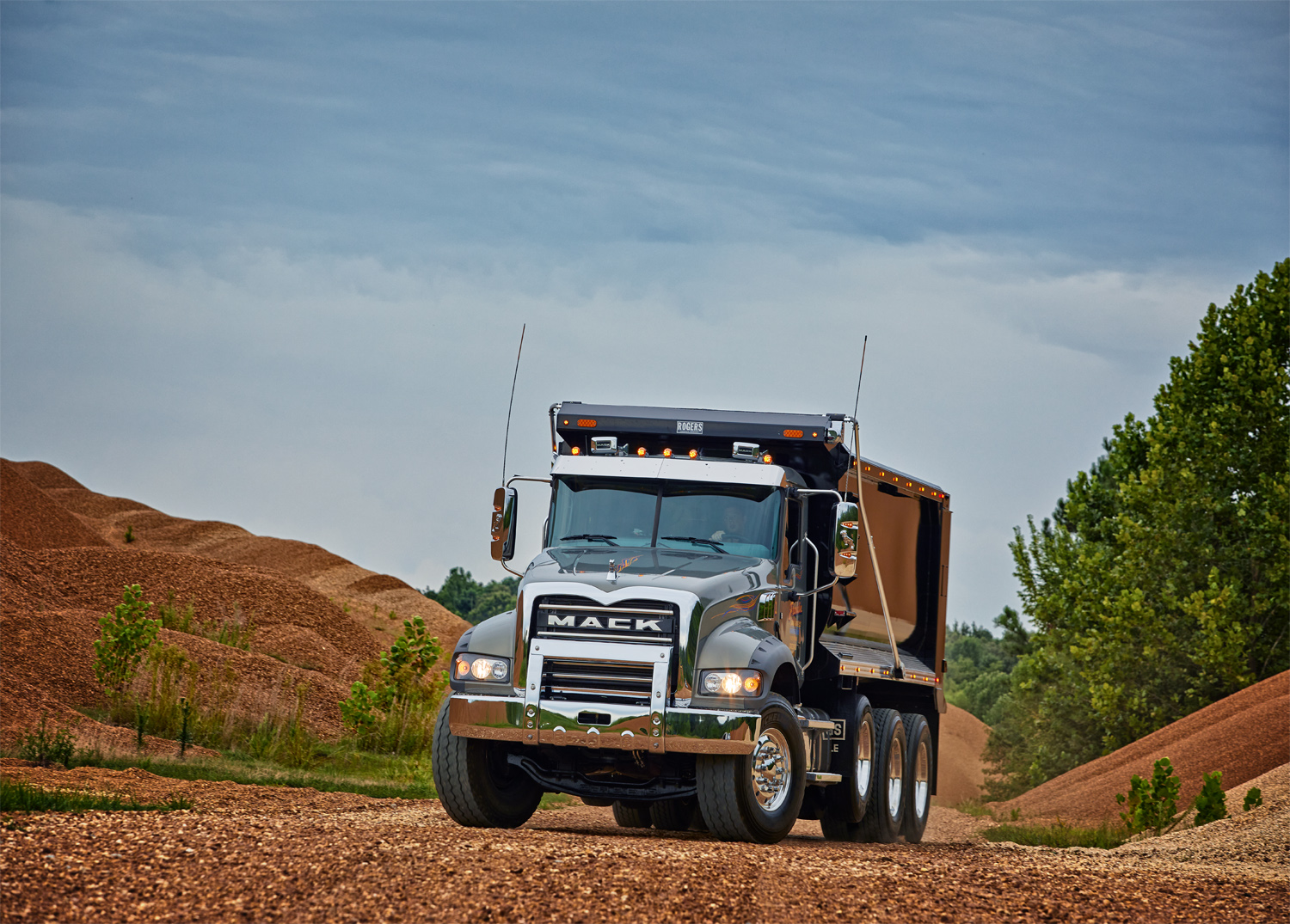 A Mack dump truck poses for photos in a Kentucky quarry