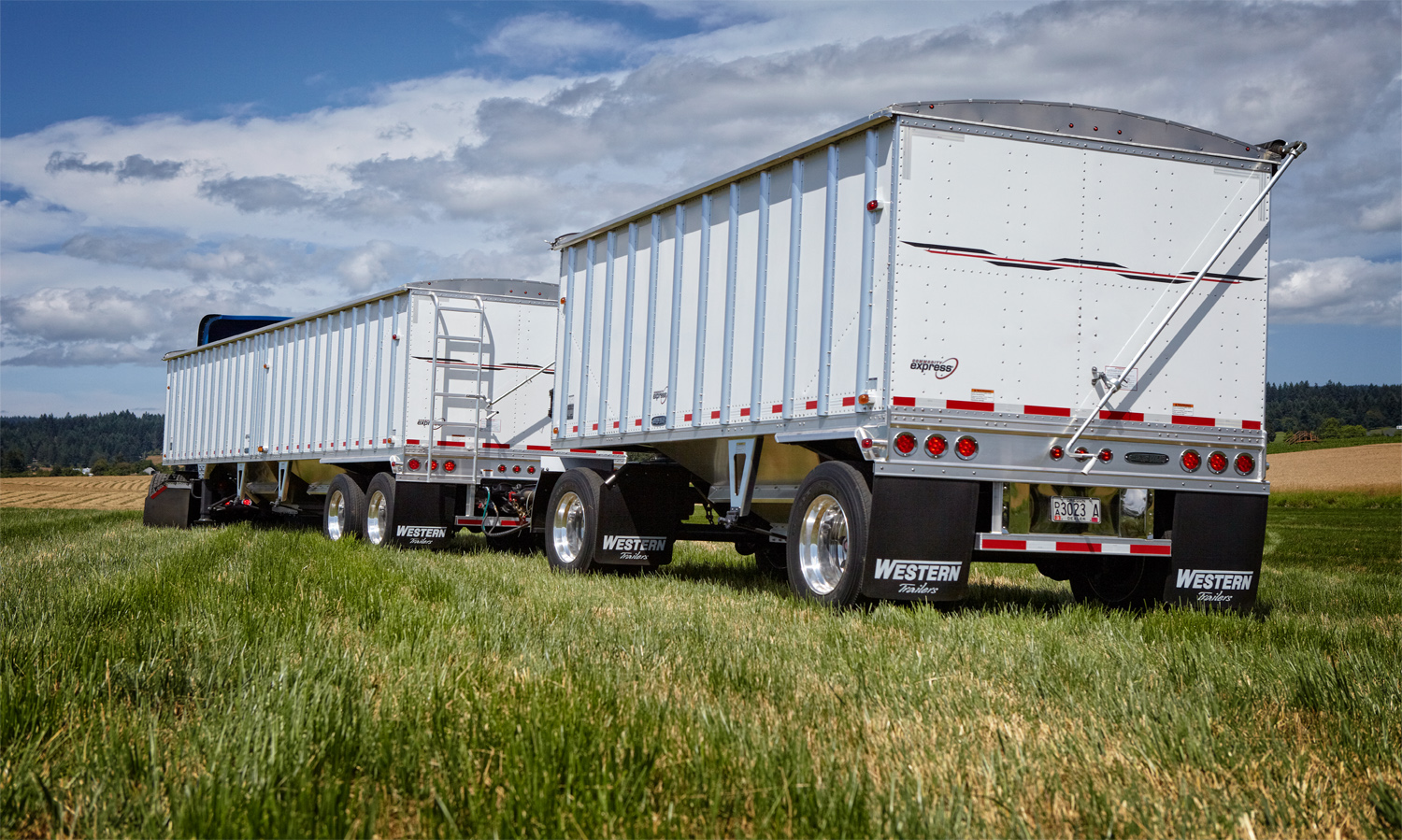 A pair of Western Trailer grain hoppers, photographed in a field in Oregon