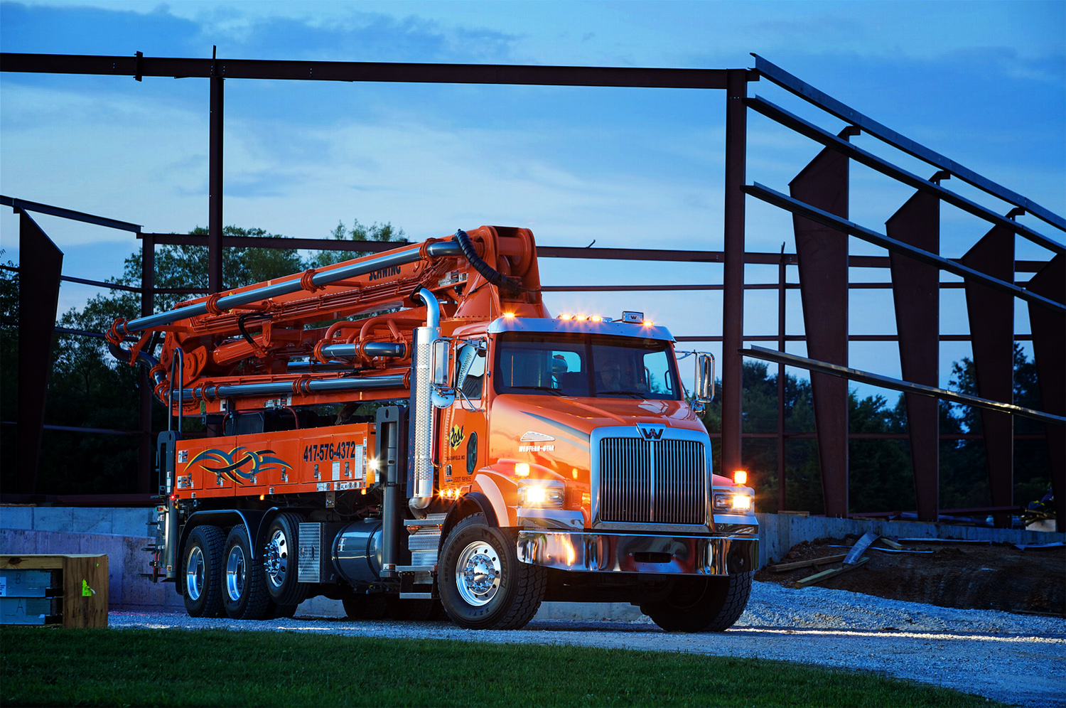 A husky Western Star 4800 arrives on a job site, ready to pump cement.