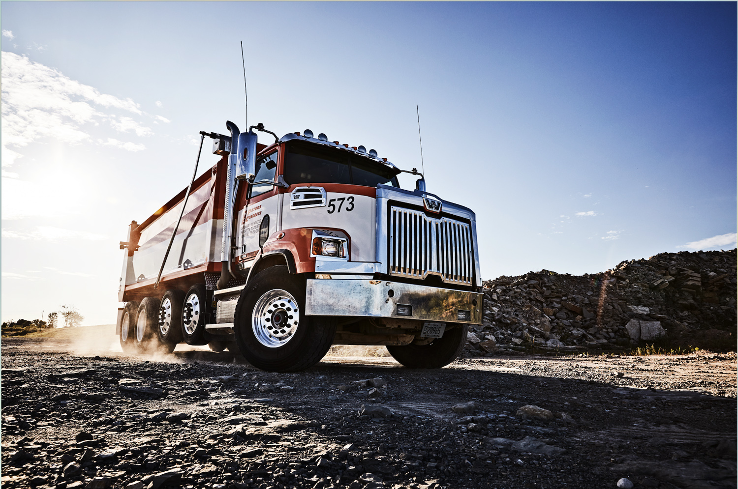 A husky Western Star 4800 dump truck loaded with rock in a Wisconsin quarry