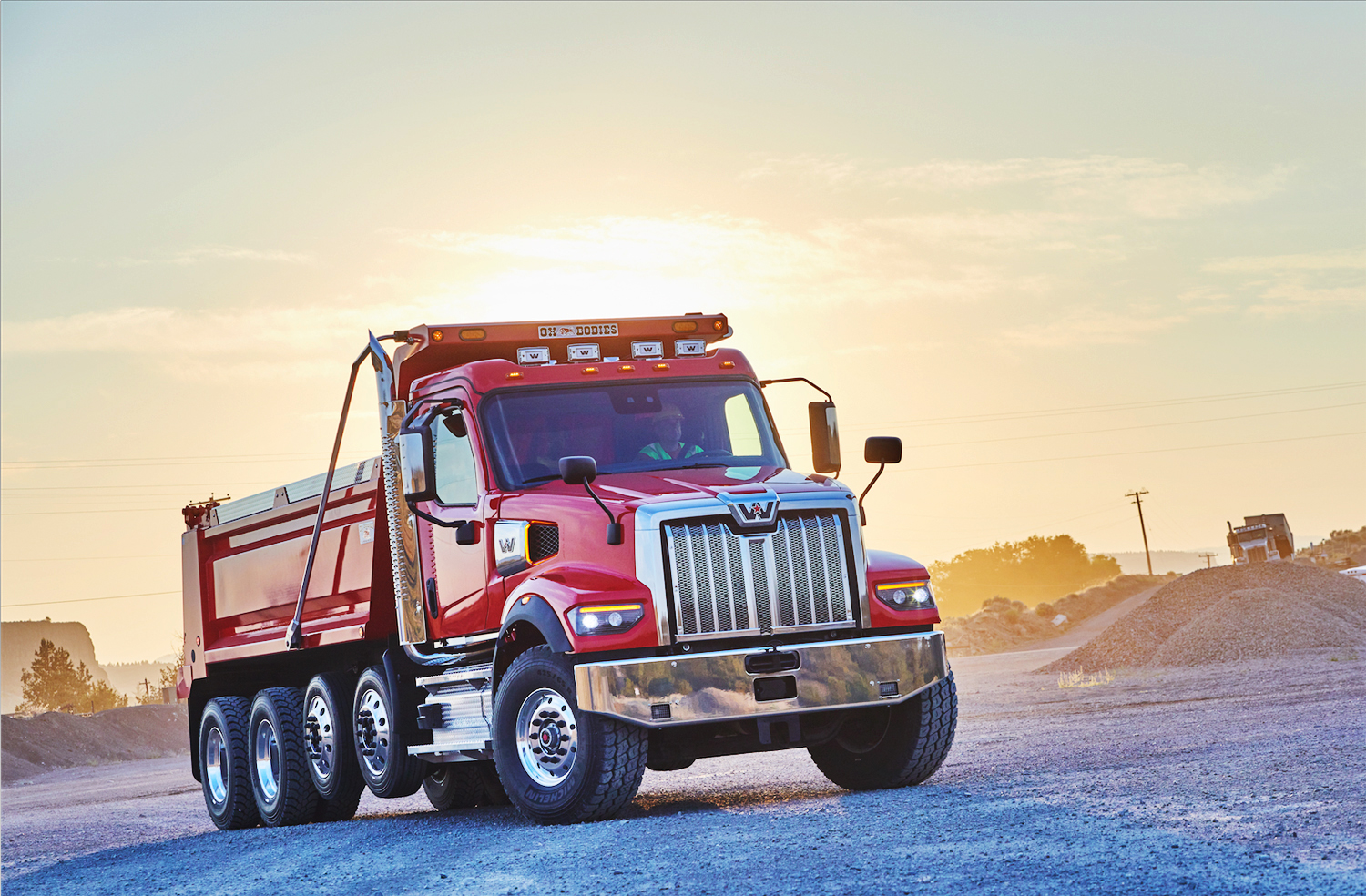 A bold red Western Star 49X dump truck shines brightly at a quarry in Oregon.