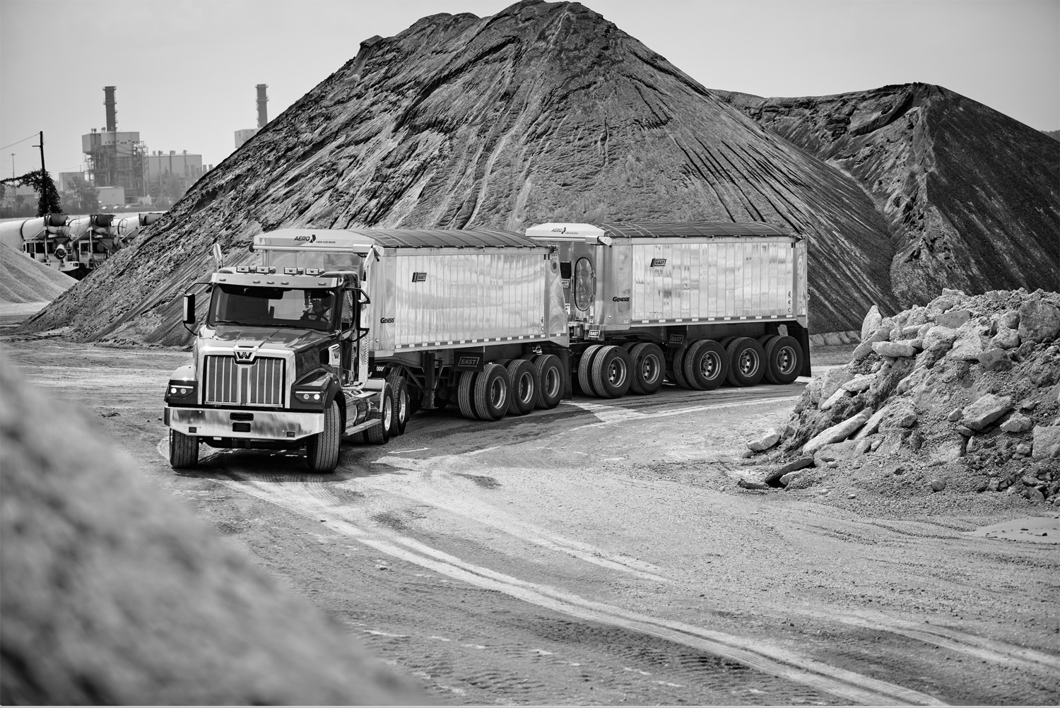 A muscular Western Star 47X leaves a quarry in Michigan with two trailers full of gravel.